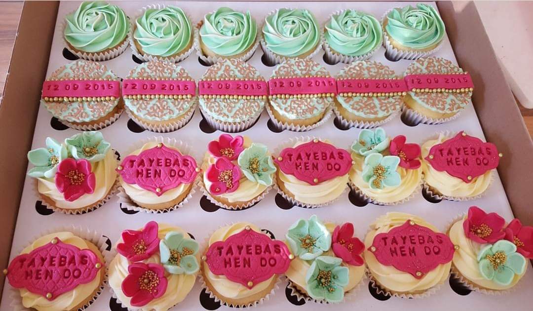 A box of twenty-four handmade decorative mint green fuchsia vanilla cupcakes perfect for any kinds of occasion.