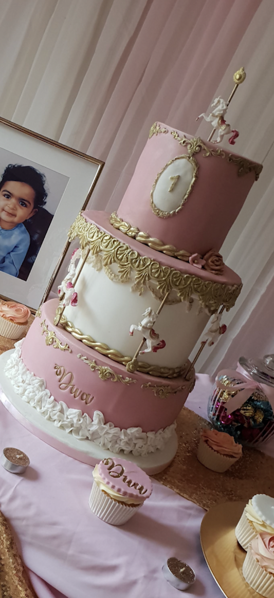 3 layered pink and white carrousel cake 